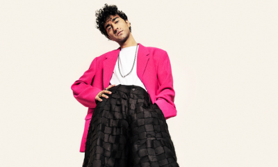 Alex Wolff in pink blazer and black pants