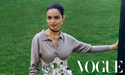 Rachel Zegler wears floral jewelry in the grass for Vogue